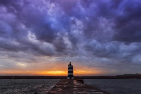 Lighthouse at the sunset time Stock Photos