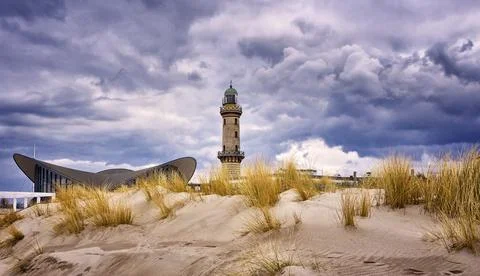 Lighthouse at the Teepott behind the dunes in Warnemunde. Stock Photos