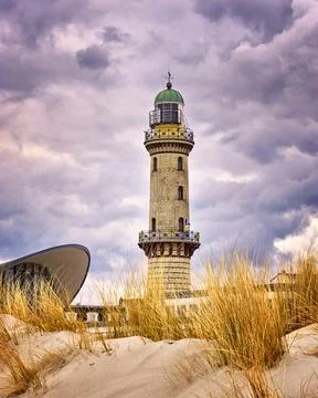 Lighthouse at the Teepott between the dunes in Warnemünde. Stock Photos