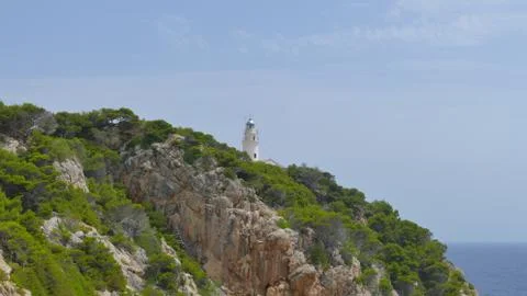 Lighthouse on top of a mountain Foto stock