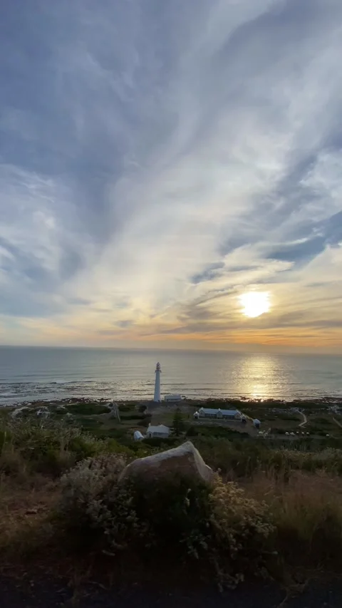 Lighthouse on top of an s sand dunes in beautiful sunset. Capetown. Vertical Stock Footage 221473866