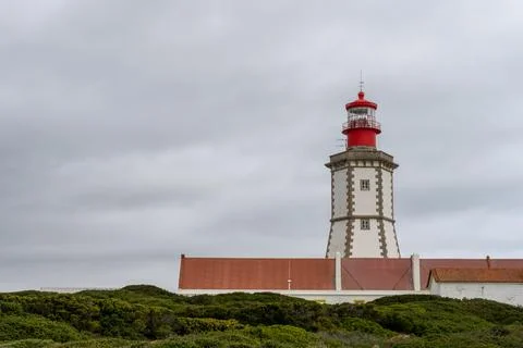 Lighthouse tower against cloudy winter sky Foto stock