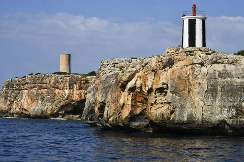 Lighthouse, tower and cliffs Stock Photos