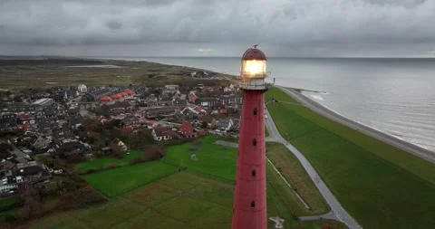 Lighthouse tower Lange Jaap in Den Helder drone aerial footage 5K along the sea Stock Footage 165194889
