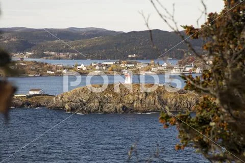 Lighthouse in Trinity Bay from Skerwink Coastline Trail, Trinity, Newfoundlan Stock Photos