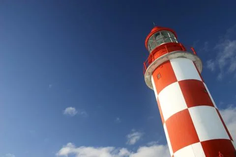 Lighthouse under a deep blue sky Stock Photos