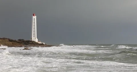Lighthouse under a gray sky Stock Footage 87544257
