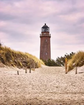 Lighthouse under sky and clouds, Darsser place on the Baltic Sea. Germany Stock Photos