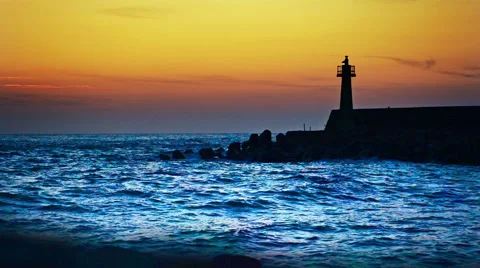 Lighthouse under sunburst Stock Footage 61803223
