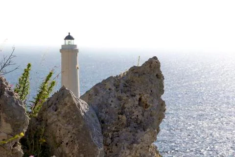 Lighthouse, view among the rocks Stock Photos