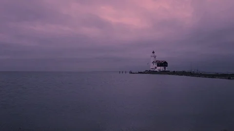 A lighthouse by the water at sunrise Stock Footage 91182038