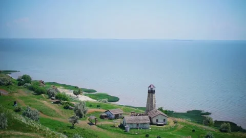 Lighthouse on the water's edge Video stock 234044046