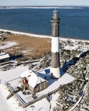 Lighthouse on a Winter Coast Stock Photos