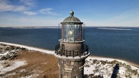 Lighthouse on a Winter Coast Stock Photos