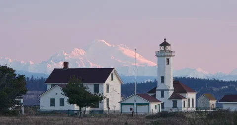 Lighthouse in winter with snowy mount baker Stock Footage 175935097