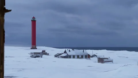Lighthouse in a winter village 스톡 동영상 249390577