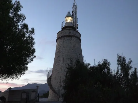 A lighthouse working in the twilight Stock Footage 80345402