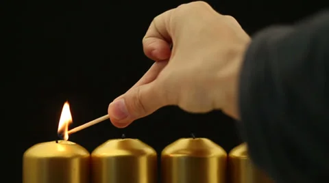 Lighting and blowing out four advent candles Stock-Footage 30582110