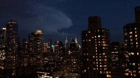 Lighting and thunder over the Empire State Building and skyline in New York City Stock Footage