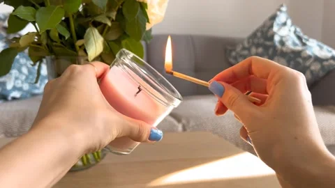 Lighting an aromatic candle for relaxation Stock Footage 332808511