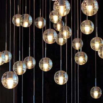 Lighting balls on the chandelier in the lamplight,  light bulbs hanging from  Stock Photos