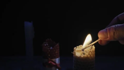 Lighting Beeswax Candles with Match in the Dark Stock Footage 329968804