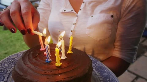Lighting birthday candles Stock Footage 58283455