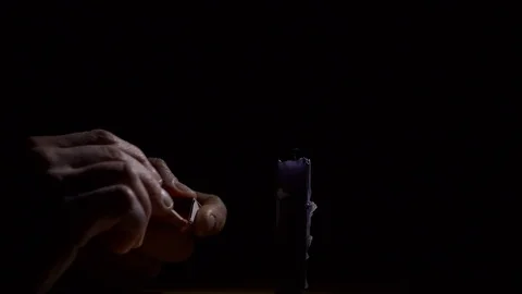 Lighting black candle with matches slow motion Vídeo Stock 74769998