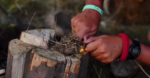 Lighting up bonfire with flint Stock-Footage 58107326