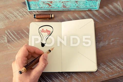 Lighting bulb as STRATEGY symbol and concept Stock Photos