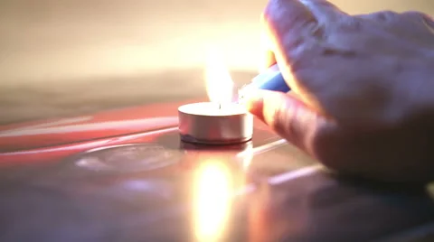 Lighting a candle in a abstract background Stock-Footage 55630571