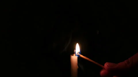 Lighting a candle and blowing out Stock Footage 45437517