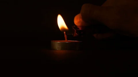 Lighting the Candle in black background Stock Footage 114052393
