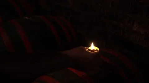 Lighting a candle in the cellar Stock Footage 53808576