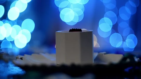 Lighting a candle on the Christmas table with a match. Stock Footage 259693106