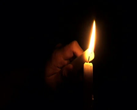 Lighting a candle in the dark 库存影片 45500042
