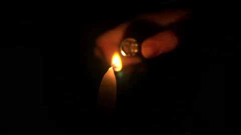 Lighting a candle in the dark Stock Footage 304805796