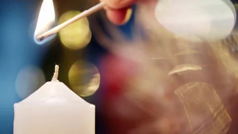 Lighting up a candle Stock Footage 129154681