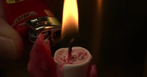 LIGHTING CANDLE with LIGHTER, RED Lighter, SLOW MOTION, MACRO LENS Video stock 255972346