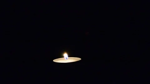 Lighting candle match on black. single two candle burning on dark Stock Footage 99826288