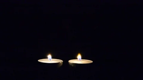 Lighting candle match on black. single two candle burning on dark 動画素材 99826489