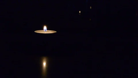 Lighting candle match on black. single two candle burning on dark Видео 99827217