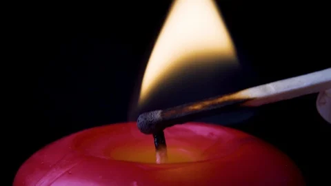 Lighting a Candle With a Match Close up Video stock 113404377