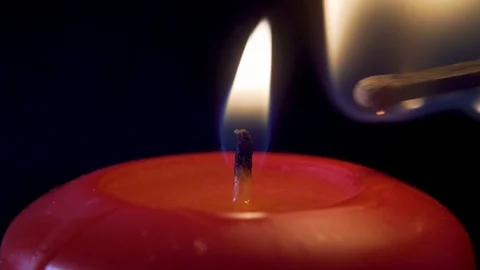 Lighting a Candle With a Match Close up Video stock 113416559