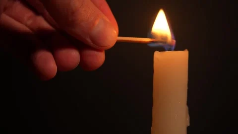 Lighting a candle with a match in complete darkness Stock Footage 320191723