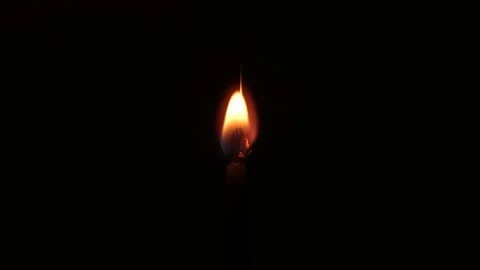 Lighting a Candle with a Match in the Dark Stock Footage 333912292