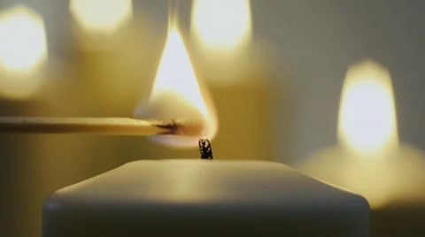 Lighting candle with match flame 動画素材 47930534