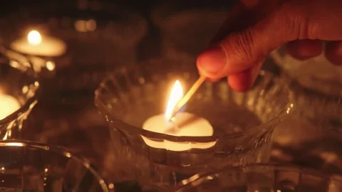 Lighting Candle with Match Vídeos de archivo 282628781