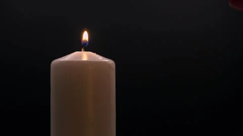 Lighting a candle with a match Full HD 60fps Video stock 322982597