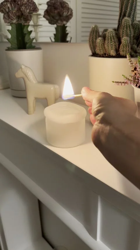 Lighting a Candle with Matchstick on Fireplace 4K 60fps Stockbeeldmateriaal 344822139